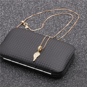 Golden necklace with cubic zirconia angel wing pendant on a premium black display box