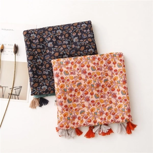 Ethnic floral cotton linen scarf with colorful tassels in blue and orange floral print