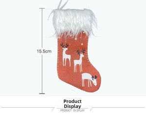 Detail view of 15.5cm red Christmas stocking with white reindeer and plush cuff decoration