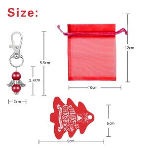 Detail view of Christmas angel wing keychain set with red pearl and sizing measurements