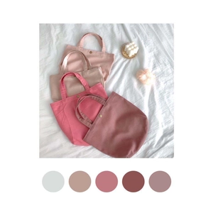 Detailed view of Morandi color canvas tote bags with metal snap button and soft textures