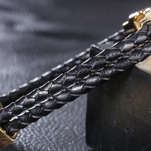 Men's double-layered black woven leather bracelet with polished gold stainless steel clasp
