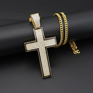Men's hip hop gold iced out cross pendant with cubic zirconia on a classic Cuban link chain