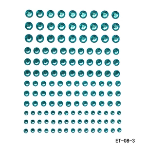 Detailed view of self-adhesive teal rhinestones in two sizes for DIY face and body makeup