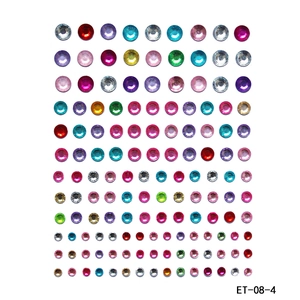 Detailed macro view of colorful round acrylic rhinestone face gems in various sizes