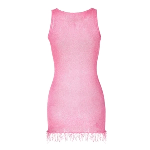 Detail of pink knitted mini dress featuring a racerback design and dense fringe hemline