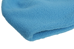 Close-up of light blue fleece fabric with neat stitching on a warm sports cycling cap