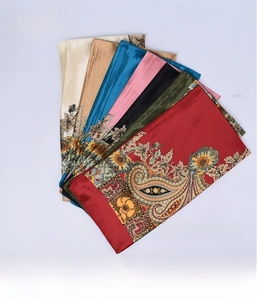 Close-up of 90cm satin square scarves featuring classic paisley floral patterns in vibrant colors