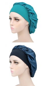 Detailed view of teal and navy satin sleep bonnets with wide elastic bands