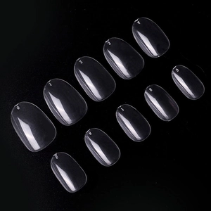 Detailed view of 10 sizes of transparent oval false nail tips from size 0 to 9