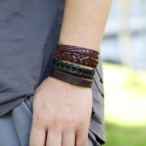 Men's multilayer braided leather bracelet set in black and brown tones on wrist