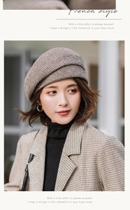 Detail of a vintage French plaid beret in brown houndstooth wool for stylish autumn wear