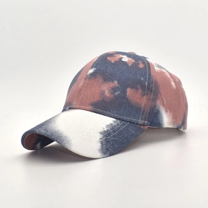 Detailed close-up of blue and brown tie-dye cotton baseball cap with six-panel structure
