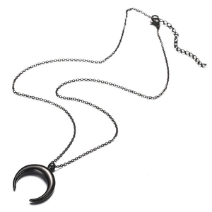 Minimalist stainless steel crescent moon pendant necklace in black finish on white background