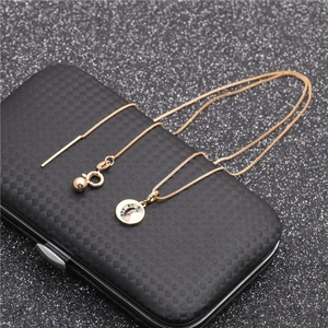 Detail of gold box chain necklace and bracelet with multi-color zircon moon pendant