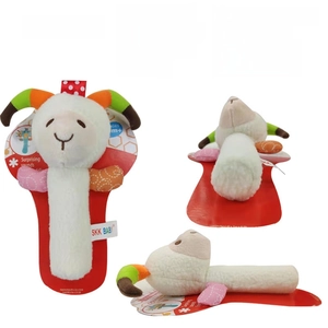 Detail view of plush white lamb rattle toy with dimensions sixteen by three point five cm