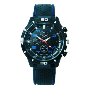 Macro shot of sports watch dial with blue stitching silicone strap and chronograph sub-dials
