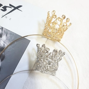 Detailed view of gold and silver rhinestone princess crowns for girls on metal headbands