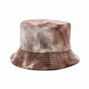 Detailed texture of tie-dye corduroy fabric on a brown and white vintage bucket hat
