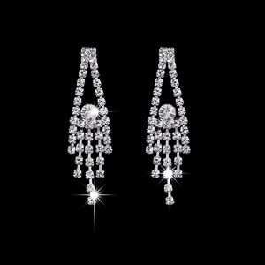Elegant silver tassel earrings with sparkling crystal rhinestones on a dark background