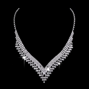 Luxurious silver-plated V-shaped necklace with shimmering crystals on a black background