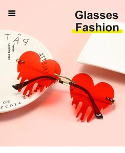 Detail of red heart-shaped rimless sunglasses with unique flame teardrop design