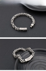 Detail of vintage silver Byzantine style stainless steel chain bracelet for men