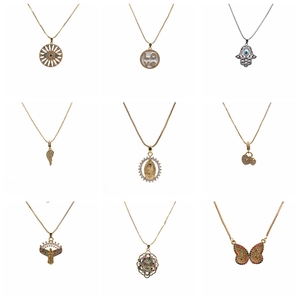 Micro-pave zircon cross pendants and multi-style gold necklaces on white background