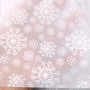 Translucent white Christmas tissue paper with snowflake print for gift wrapping