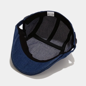Blue washed denim ivy cap featuring 100% cotton material and premium interior lining