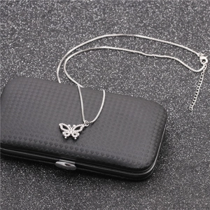 Silver butterfly pendant necklace for women with sparkling rhinestones on jewelry box