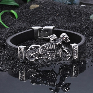 Punk rocker leather bracelet with stainless steel motorcycle skull charm on black sand