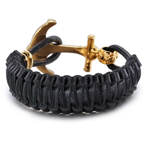 Braided leather bracelet for men featuring a gold-toned anchor clasp on white background