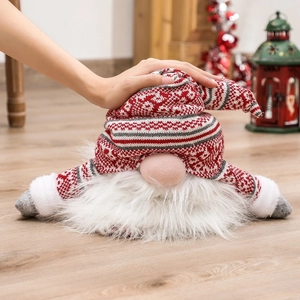 Nordic Christmas gnome tree topper made of red and grey plush knit fabric