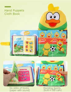 Detail of yellow duck hand puppet cloth book with crinkle paper and sound features