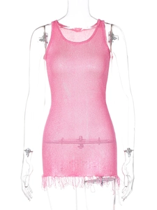 Detailed macro shot of pink knit summer dress showing transparent texture and fringe hem