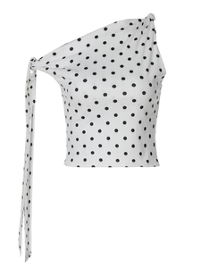 Detail of the chic black polka dots print and knot shoulder tie on this white crop top