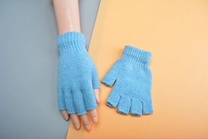 Detailed view of blue knitted fingerless wool gloves showing texture and ribbing