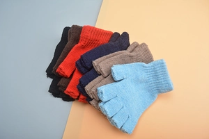 Detailed flat lay of knitted wool fingerless gloves in various colors for winter warmth