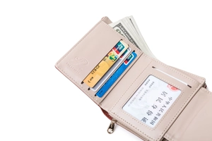 Detailed view of internal card slots and transparent window in light pink PU leather wallet