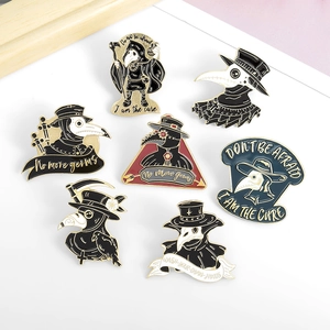 Detail showing seven plague doctor enamel pins with bird masks and gothic slogans on white