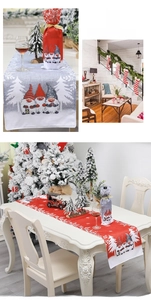 Detailed view of Christmas gnome table runner and wine bottle covers for holiday dining decor