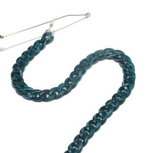 Macro view of dark green marble acrylic glasses chain with thick resin link details