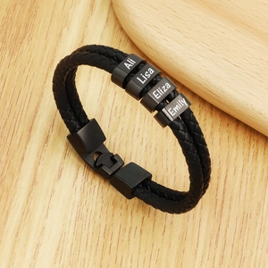 Custom braided black leather bracelet with four personalized engraved name metal rings