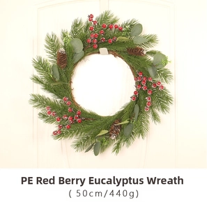 Detailed view of 50cm Christmas wreath with PE pine needles, red berries and eucalyptus