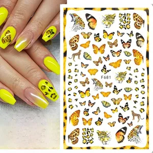 Detail of 3D nail art stickers featuring golden butterflies and leopard prints model F681