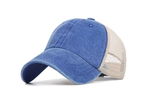 Close-up of mesh trucker hat featuring washed blue denim and breathable cream net