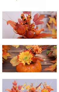 Detailansicht künstlicher Kürbisse, Ahornblätter und Sonnenblumen für herbstliche Deko
