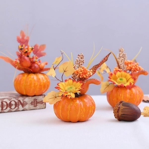 Three decorative foam pumpkins with sunflowers and maple leaves for Halloween table decor