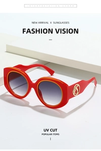 Detailed side view of red wide-frame sunglasses with golden S logo and UV cut lens